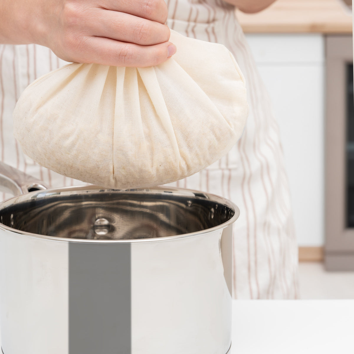 Cotton jelly straining bag held over a pot; pot not included