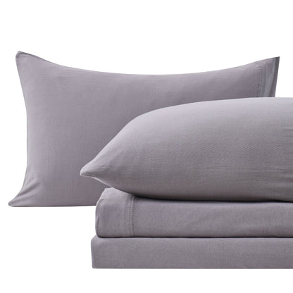 Close-up of Charcoal cotton jersey-knit pillowcases and matching sheet fabric.