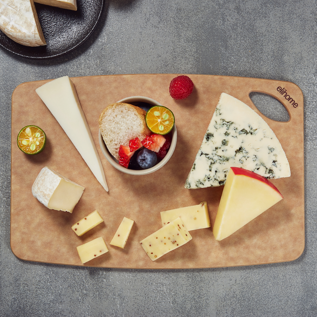 Small Elihome cutting board styled with cheese and fruit; food and props are not included.