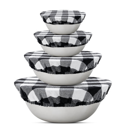 Four black and white checked cloth covers on graduated bowls