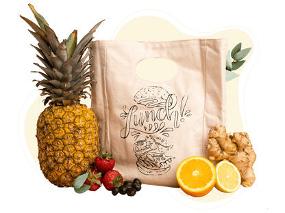 Printed canvas lunch bag beside fruit; food is not included