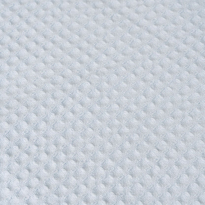 Close-up of light blue cotton waffle weave fabric
