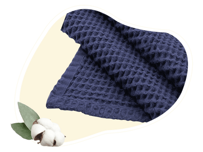 Close-up of a blue cotton throw showing its waffle texture