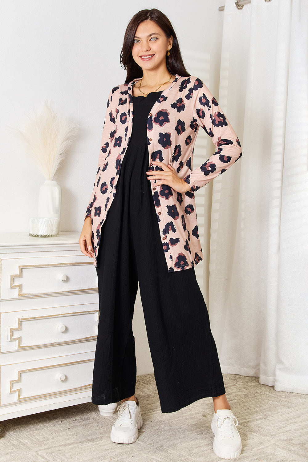 Full-length styling view of the leopard-print cardigan; cardigan only.