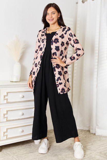 Full-length styling view of the leopard-print cardigan; cardigan only.