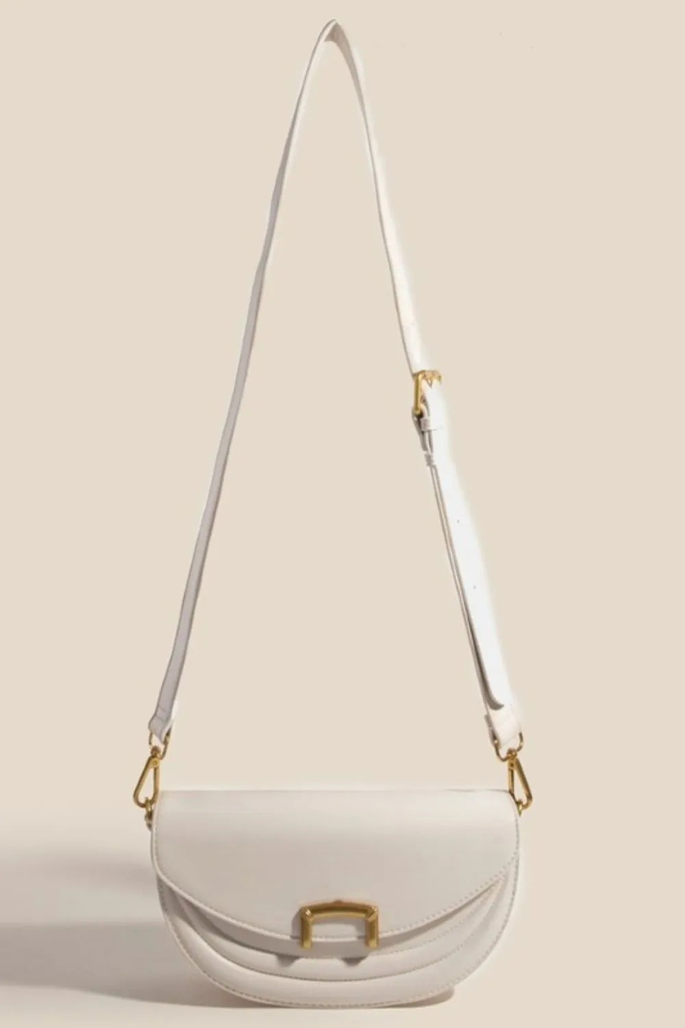 Beige crossbody bag with adjustable strap extended