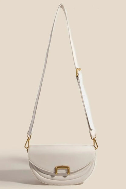 Beige crossbody bag with adjustable strap extended