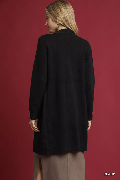 Back view of black Umgee long-sleeve cardigan, styled over a taupe dress; dress not included.