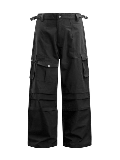 Black wide-leg cargo trousers with flap pockets and waist buckle tabs, front view