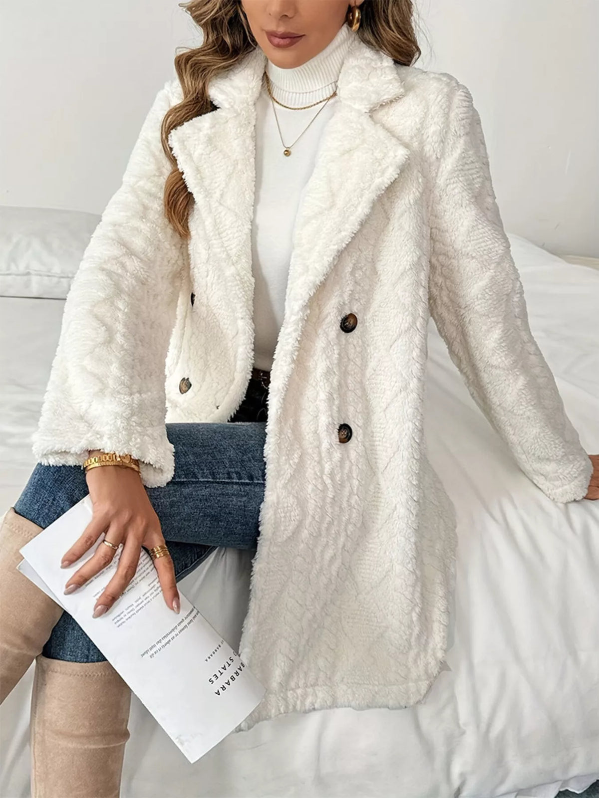 White fleece double-breasted longline coat, seated full-length view