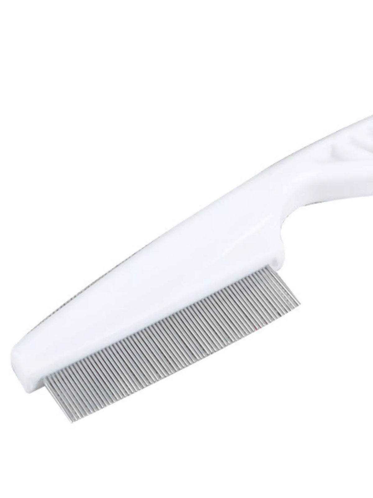 Close-up of the fine teeth on a white pet comb.