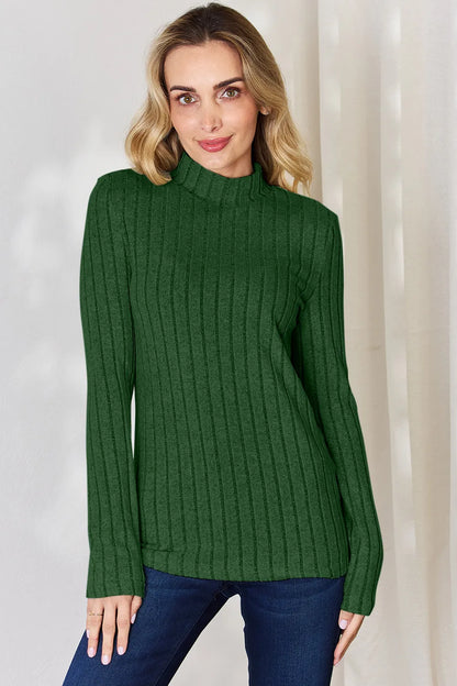 Green ribbed mock-neck long-sleeve top, product view; one top included, jeans and accessories excluded