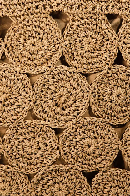 Close-up of the tote's circular braided paper-blend pattern.