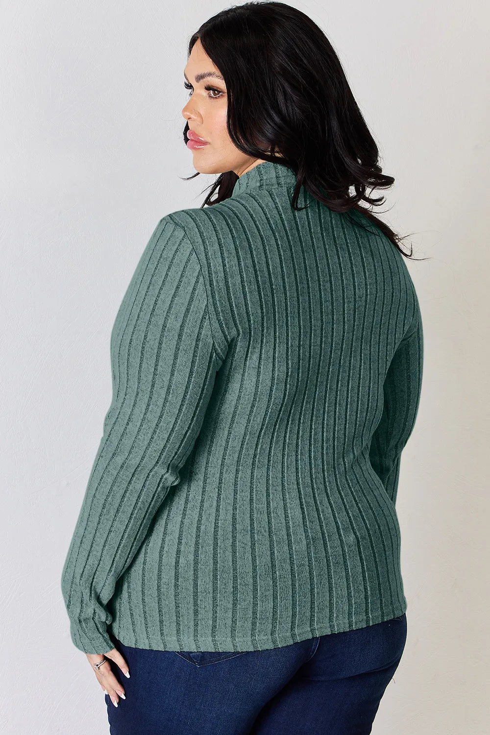 Turquoise ribbed mock-neck long-sleeve top, product view; one top included, jeans and accessories excluded