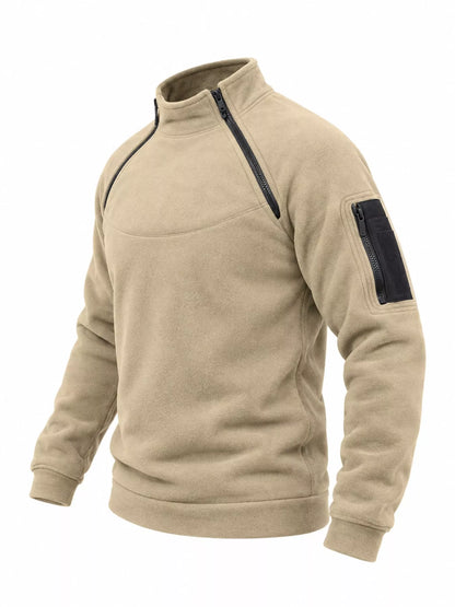 Tan men's fleece sweatshirt with stand collar, two angled neckline zips and a zippered sleeve pocket, side product view. One sweatshirt only.