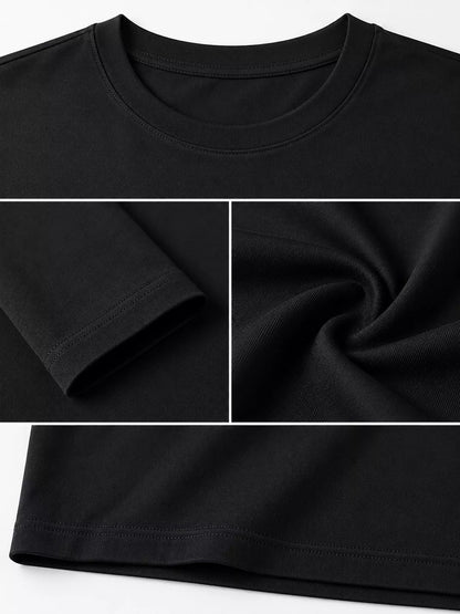 Black men's cotton long-sleeve crewneck tee, neckline, sleeve and hem details.