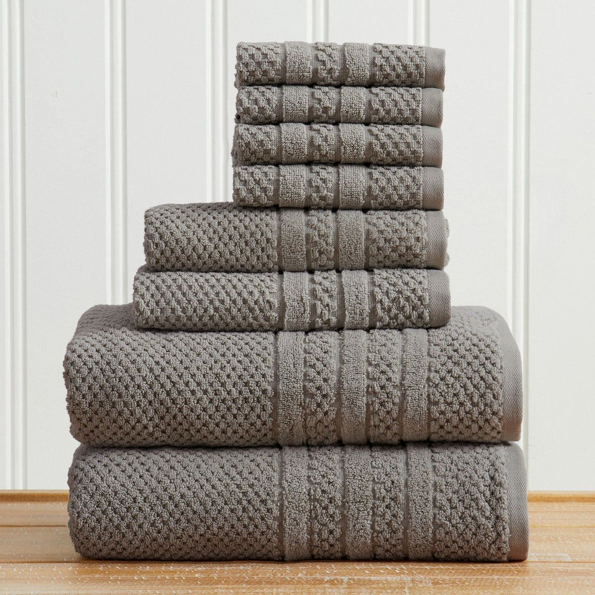 Dark Grey Giuliana Collection checkered jacquard towel set folded in a stack.