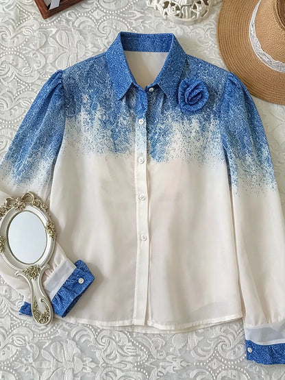 Blue-to-white gradient button-up shirt laid flat, front view