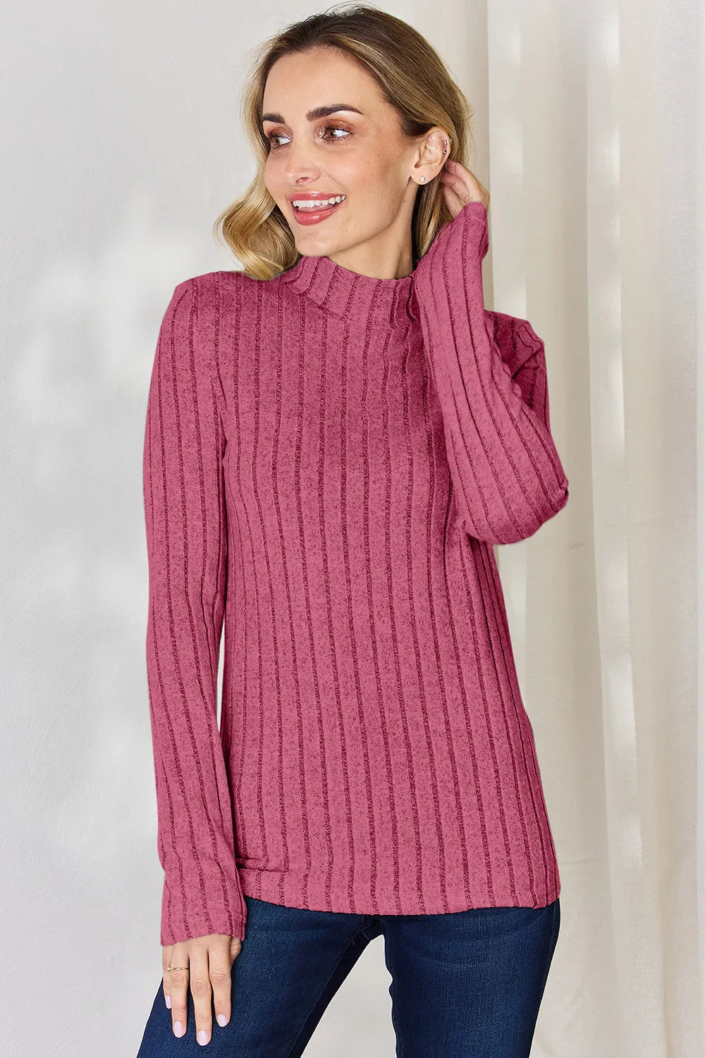 Hot Pink ribbed mock-neck long-sleeve top, product view; one top included, jeans and accessories excluded