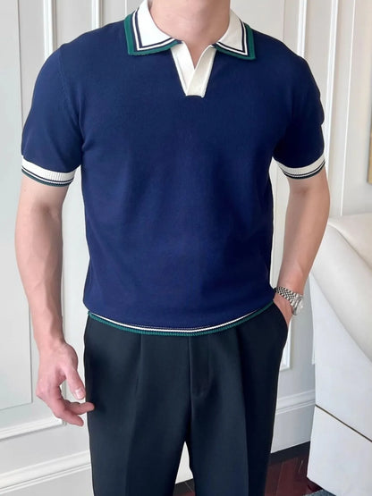 Royal Blue knit polo with white and green collar and sleeve bands, worn on a model.