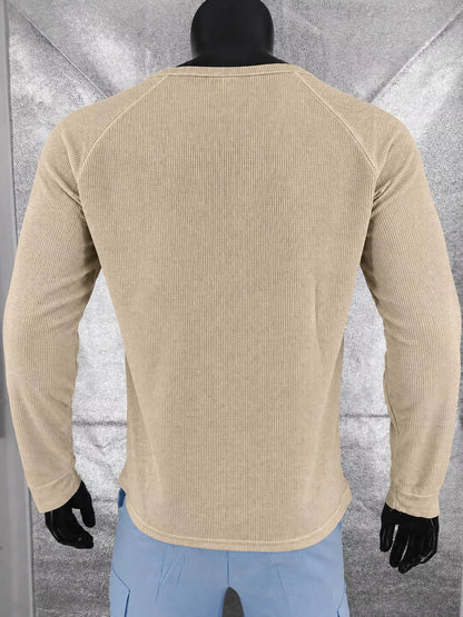 Dark khaki men’s waffle-knit Henley on a mannequin, back view.