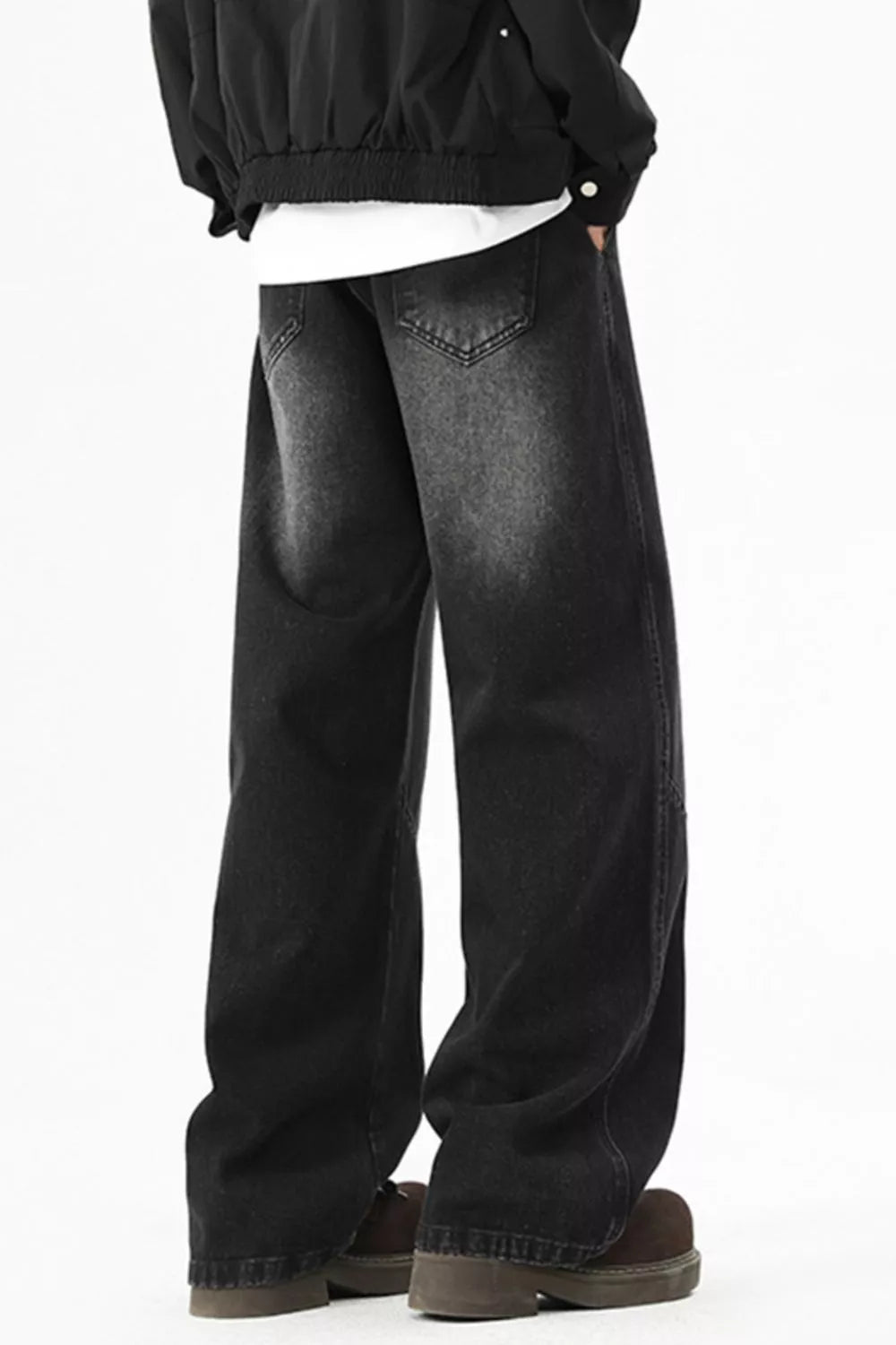 Black men's washed wide-leg jeans, rear view with back pockets.