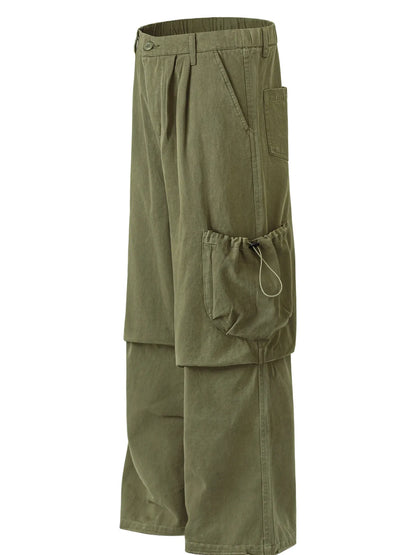 Angled garment-only view of olive cargo trousers showing a drawcord side pocket and front pleats.