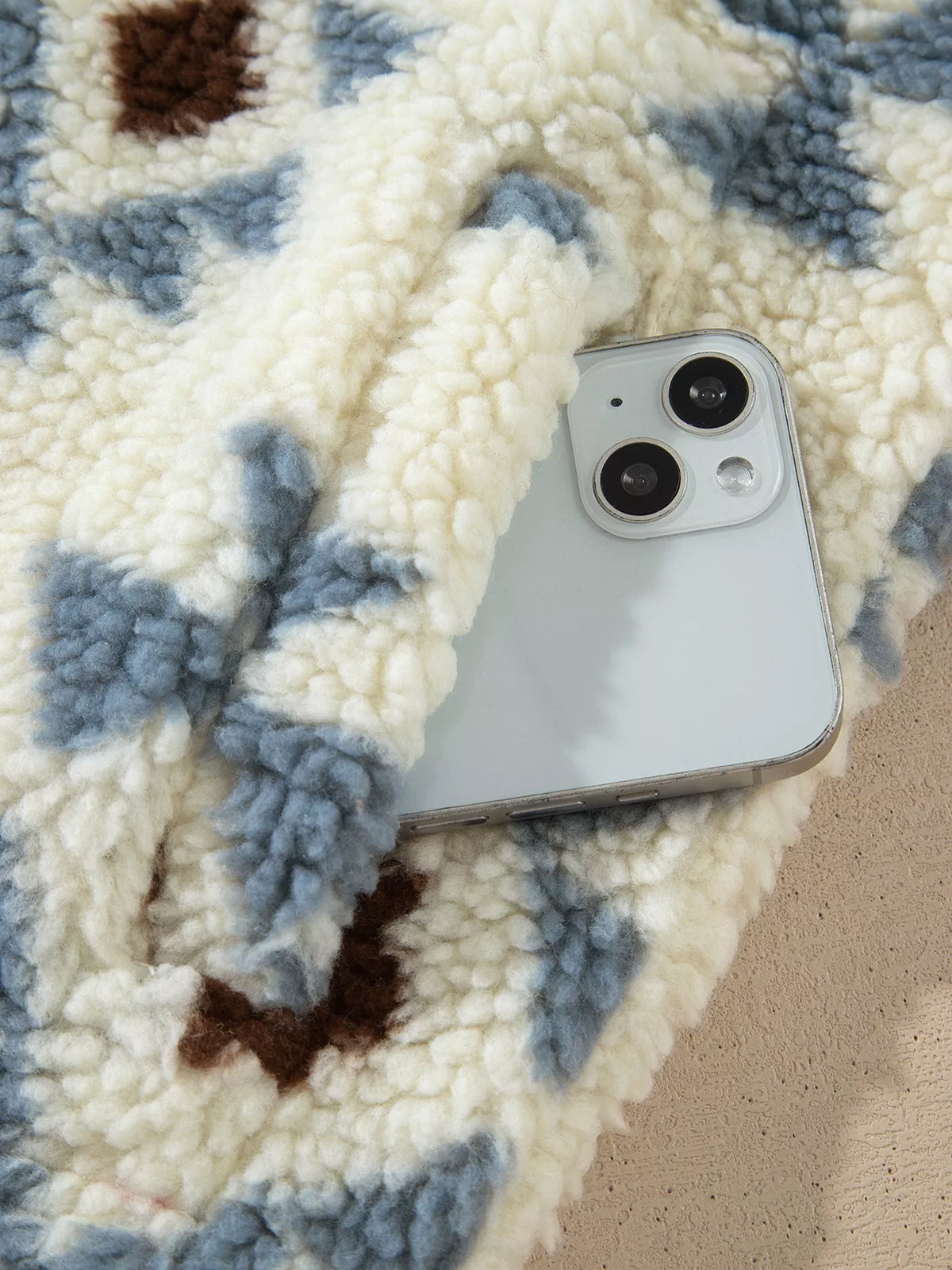 Front pocket detail with a phone shown for illustration; the phone is not included.