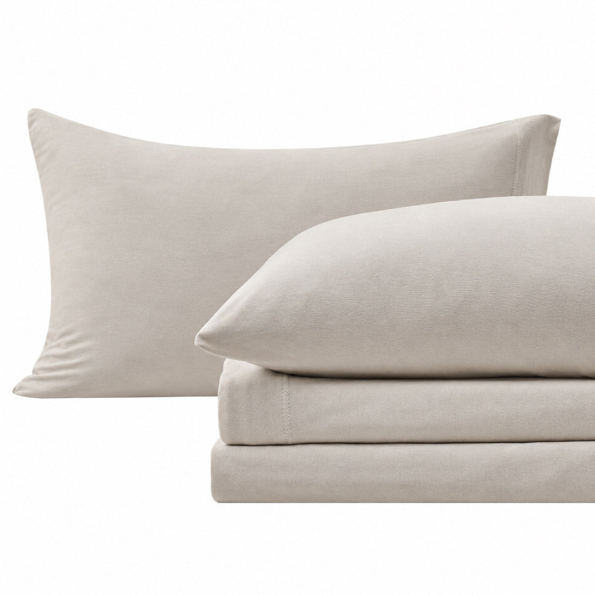 Close-up of Sand cotton jersey-knit pillowcases and matching sheet fabric.