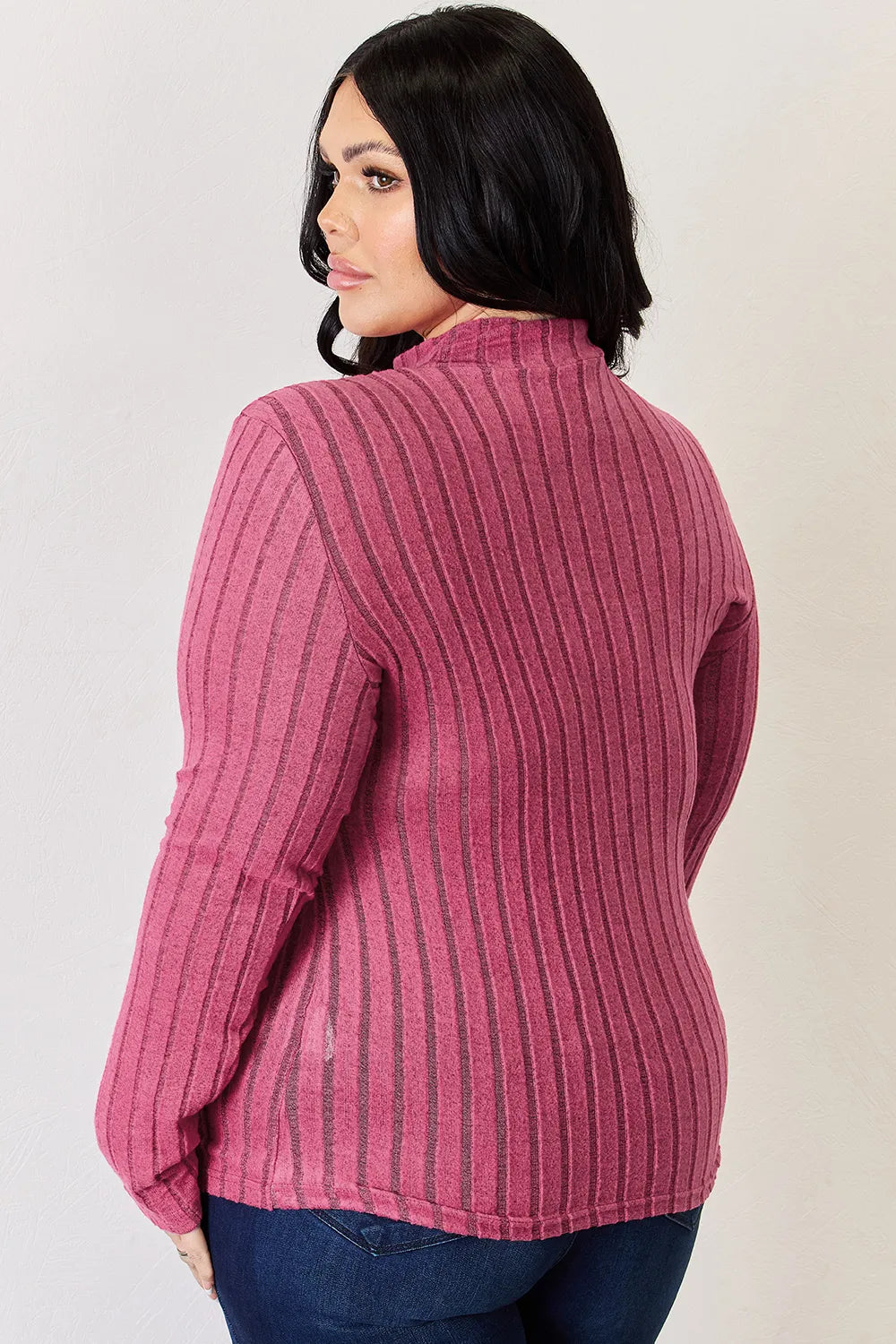 Hot Pink ribbed mock-neck long-sleeve top, product view; one top included, jeans and accessories excluded