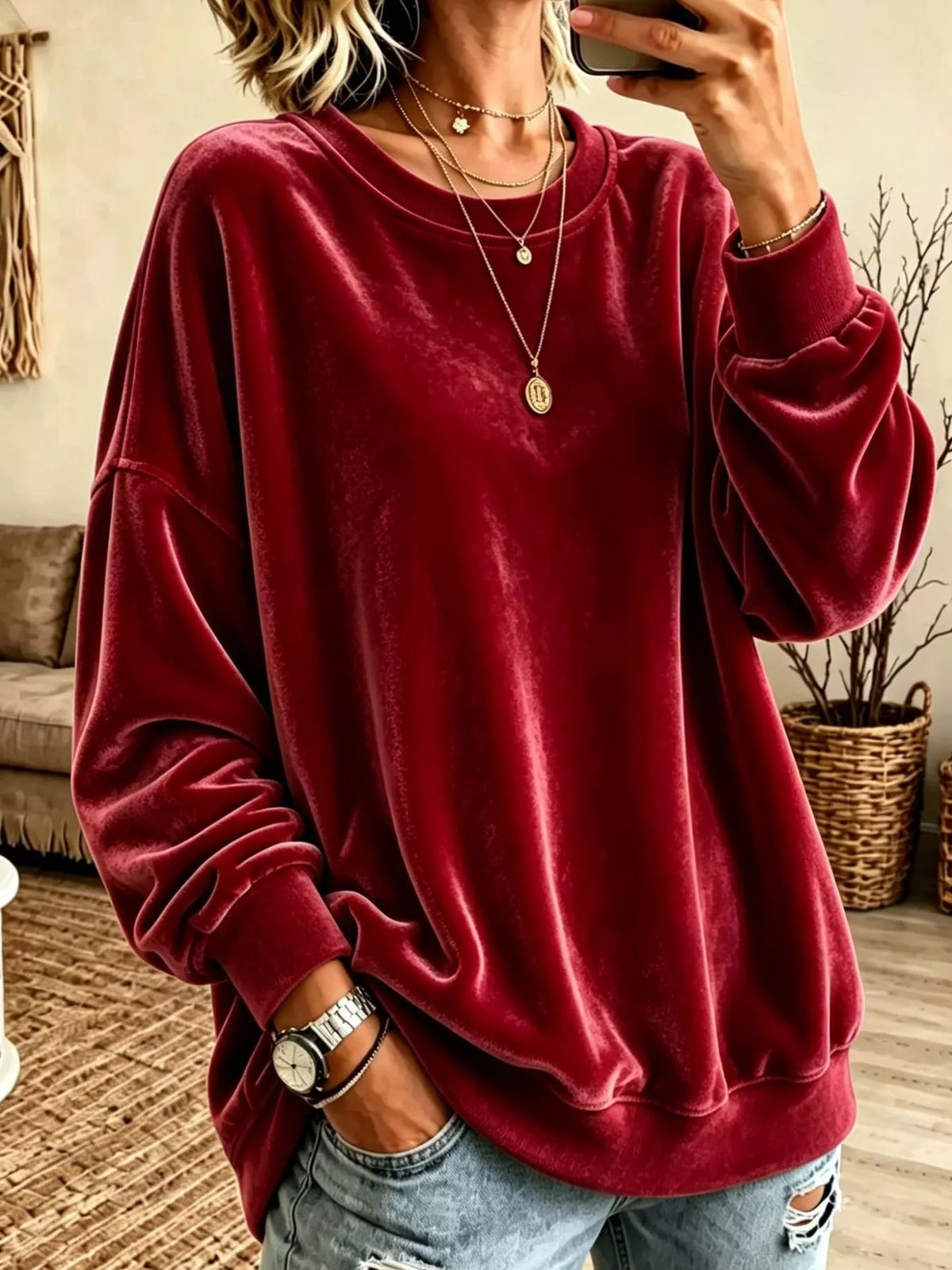 Velvet crewneck sweatshirt — Red front view. One sweatshirt only; jewellery and jeans are styling items, not included.