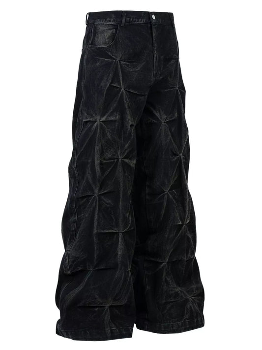 Front view of black men's wide-leg jeans with gathered seam details, belt loops and front pockets.