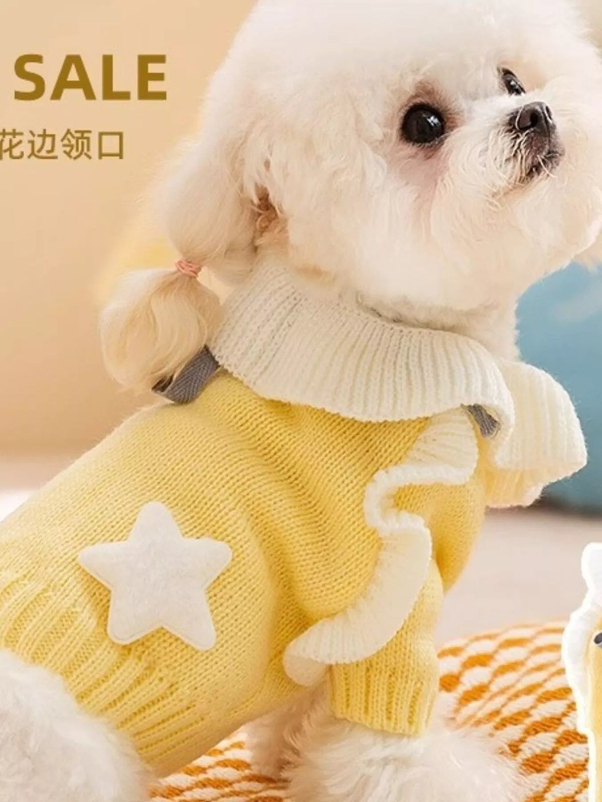 Small dog wearing a pale yellow pet sweater with white star patches; supplier photo includes a SALE text overlay.