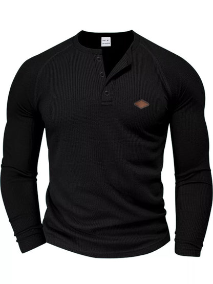 Black men’s waffle-knit Henley, front view.