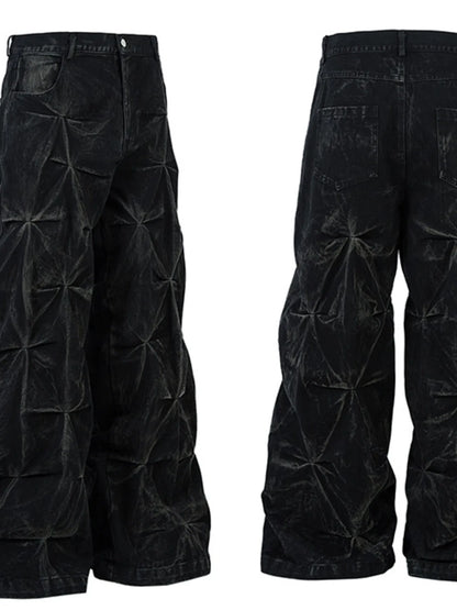 Side-by-side front and rear views of black men's wide-leg jeans with ruched seam details.