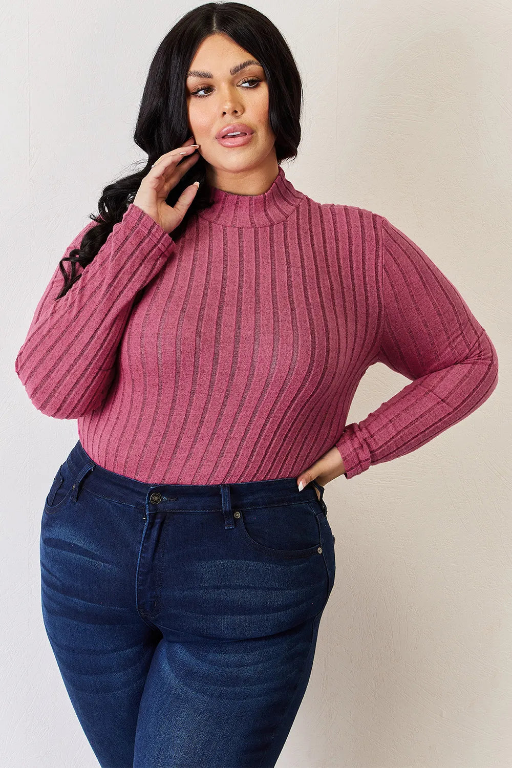 Hot Pink ribbed mock-neck long-sleeve top, product view; one top included, jeans and accessories excluded