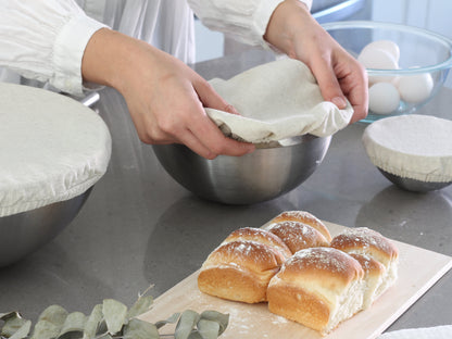Off-white elastic bowl cover used during food preparation