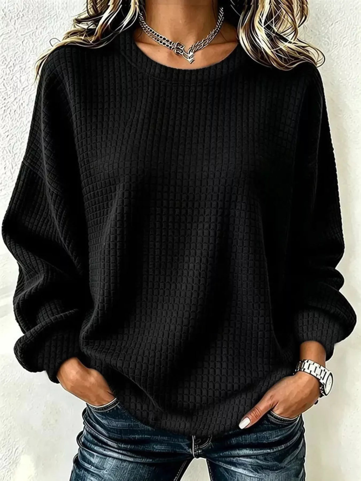 Front view of a Black long-sleeve crew-neck waffle-knit sweatshirt. One top only.