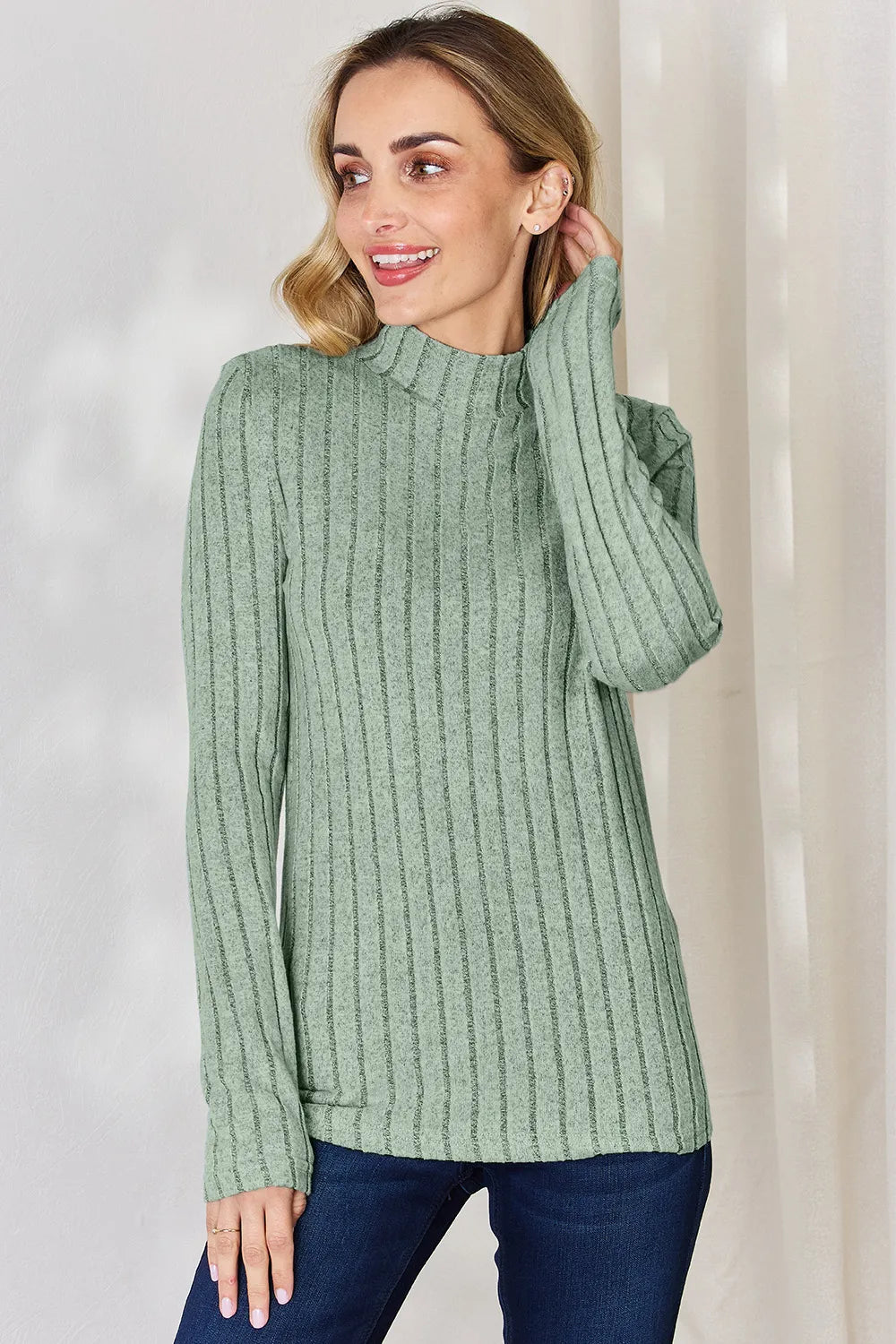 Light Green ribbed mock-neck long-sleeve top, product view; one top included, jeans and accessories excluded