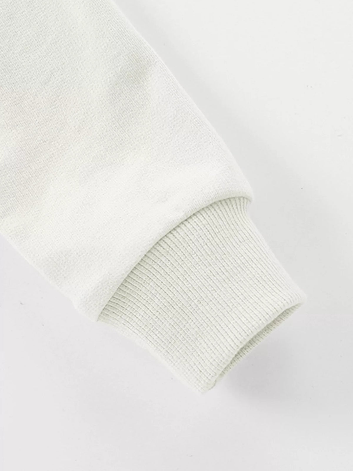 Close-up of the sweatshirt's long sleeve and ribbed cuff.