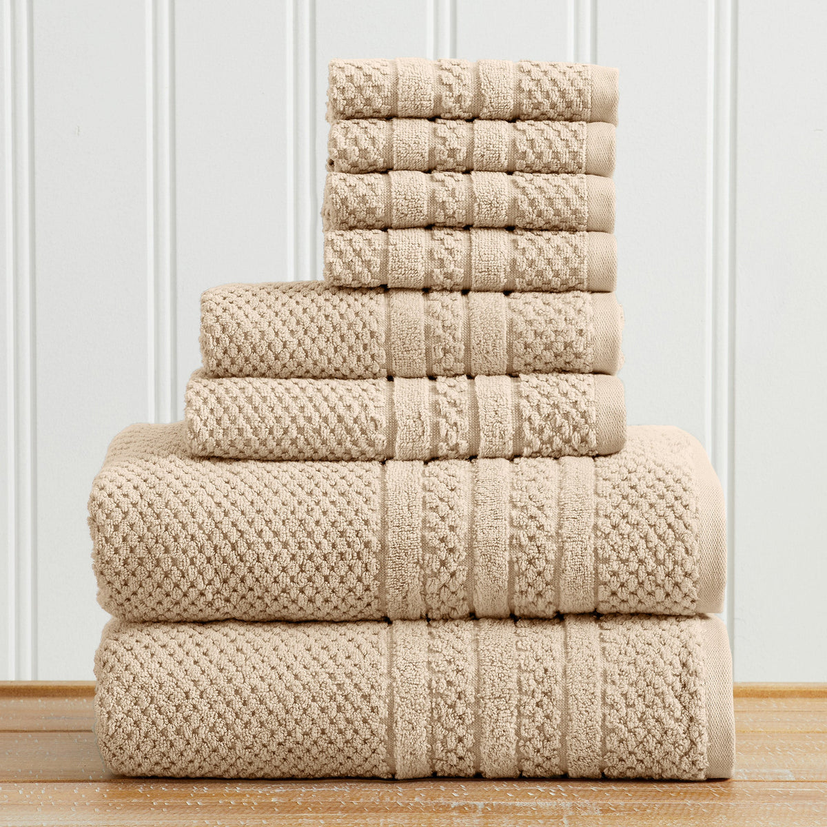 Sandstone Giuliana Collection checkered jacquard towel set folded in a stack.