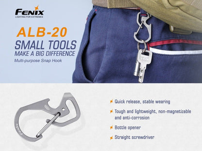 Fenix ALB-20 snap hook clipped at a belt loop with keys; feature graphic calls out its quick-release latch, bottle opener and straight screwdriver.