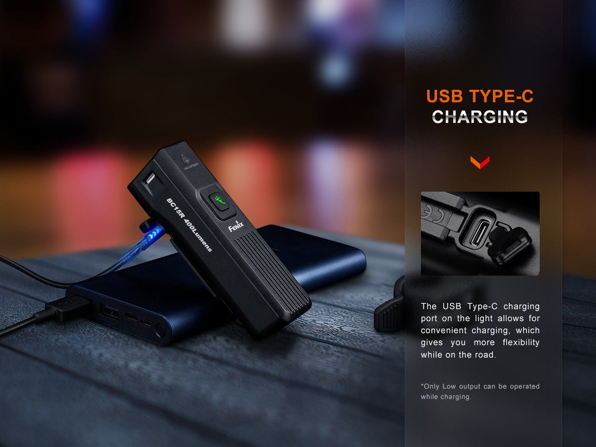 Fenix BC15R next to USB-C charging cable and open charging port