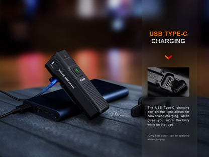 Fenix BC15R next to USB-C charging cable and open charging port