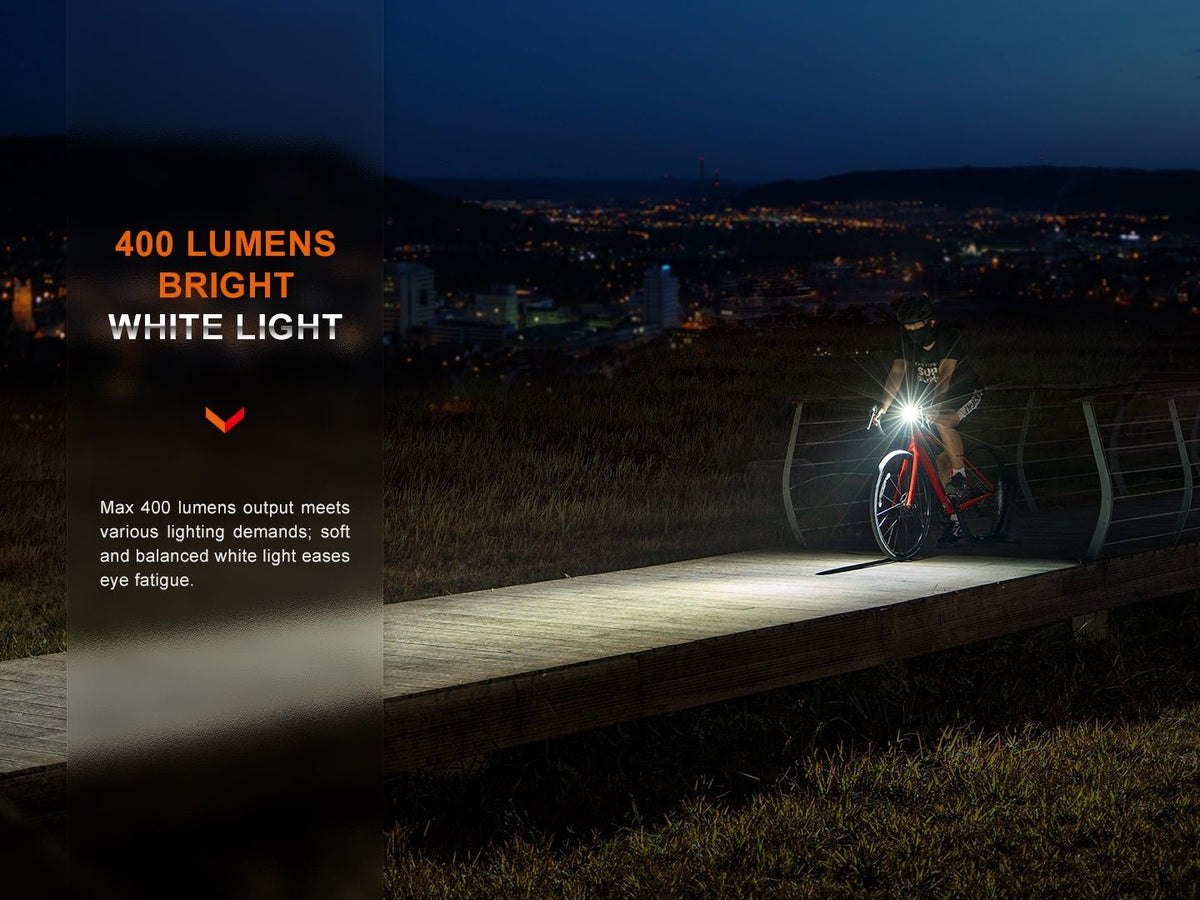 Fenix BC15R lighting a road at night, manufacturer brightness graphic