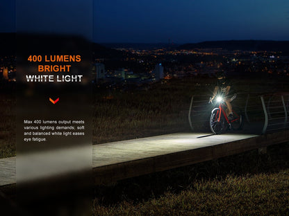Fenix BC15R lighting a road at night, manufacturer brightness graphic