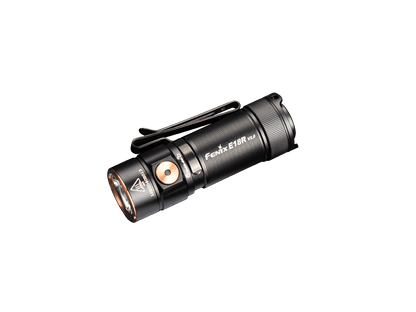 Black Fenix E18R V2 rechargeable flashlight on a green background