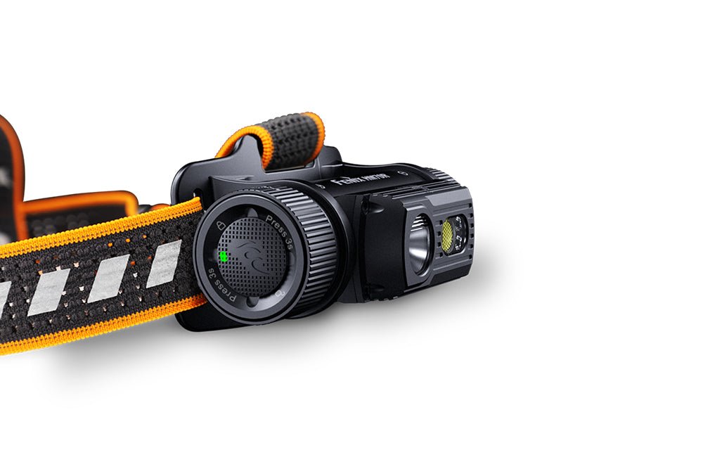 Black-and-orange Fenix HM70R headlamp on a white background