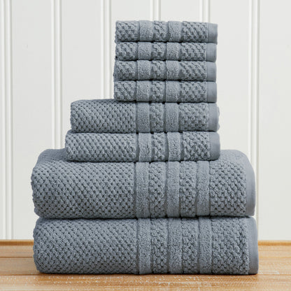 Blue Giuliana Collection checkered jacquard towel set folded in a stack.