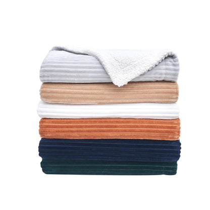 Stack of folded blankets showing the available colors; each selected blanket is sold individually, not as a bundle.